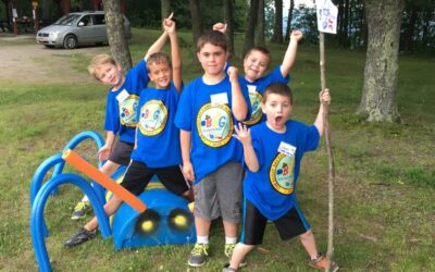 Cub Scouts with flags at Camp