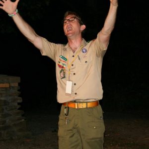 scout leader with raised arms