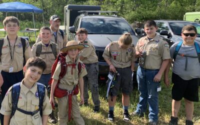 Nine youth members of Troop 87 and one of their adult leaders prepare to leave the campsite for a day of outdoor fun!