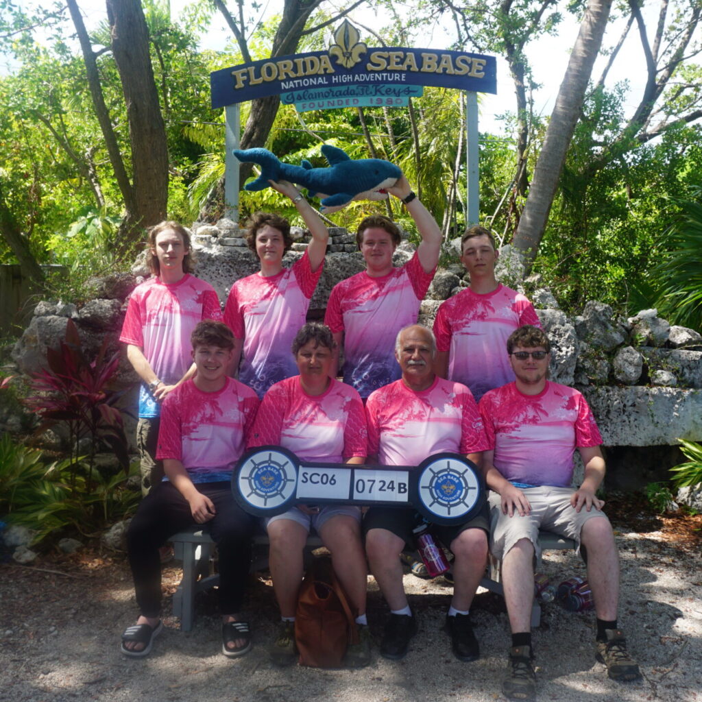 Members of Venturing Crew 4020 posing with Sea Base sign in June 2024